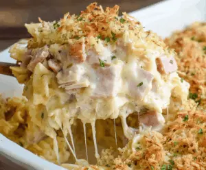 Delicious Chicken Cordon Bleu Casserole with crispy breaded chicken, ham, and melted cheese served in a baking dish