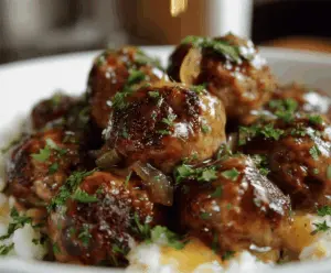 Delicious Crockpot French Onion Meatballs served in a bowl with caramelized onions and melted cheese, perfect for a savory appetizer or main dish.