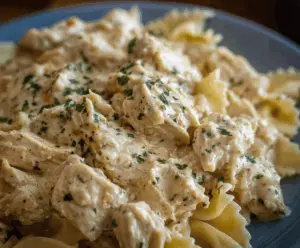 Creamy Ranch Chicken cooked in a crockpot, featuring tender chicken breasts coated with flavorful ranch seasoning and creamy sauce, served as a delicious comfort meal.