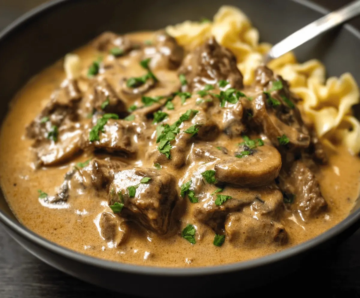 Creamy Gordon Ramsay Beef Stroganoff served with tender beef strips, mushrooms, and rich sauce on a plate, perfect for a hearty dinner.