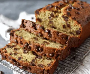 Delicious super moist chocolate chip banana bread with ripe bananas and melted chocolate chips, perfect for a sweet snack or breakfast