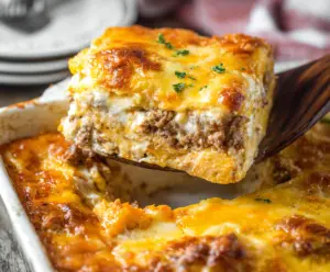 Delicious homemade lasagna with ricotta cheese, layered with rich tomato sauce and melted cheese.