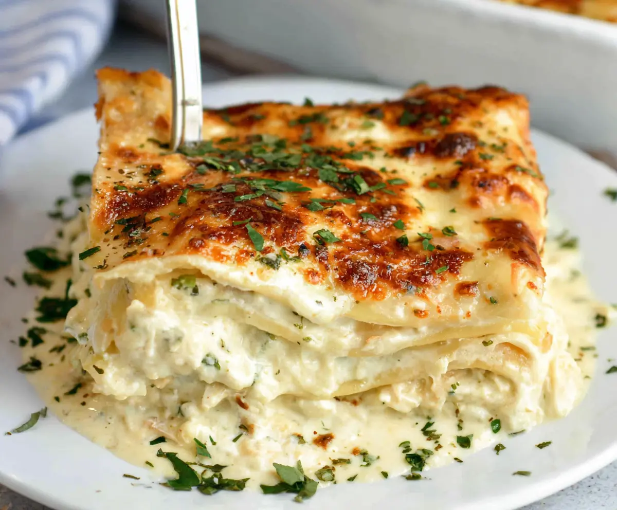 Delicious creamy white lasagna layered with rich cheese and tender pasta for a perfect dinner.