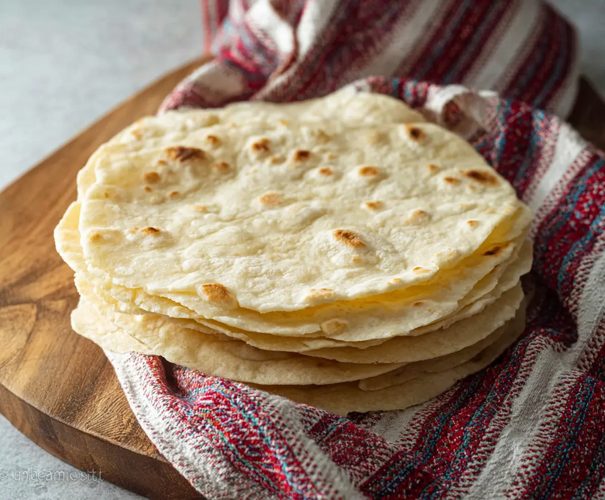 Homemade sourdough discard tortillas made with four simple ingredients, perfect for quick and delicious meals.